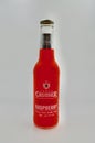 A bottle of Vodka Cruiser wild raspberry flavor against a white background