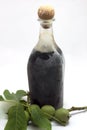 Bottle of walnut liqueur with nuts Royalty Free Stock Photo