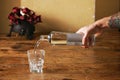 Bottle of water and glass in rustic kitchen Royalty Free Stock Photo