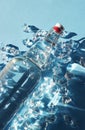 Bottle of water with ice on a blue Royalty Free Stock Photo