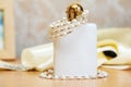 Bottle of wedding parfume with costume jewelry