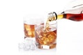 Bottle of whisky and two glasses. Pouring Royalty Free Stock Photo