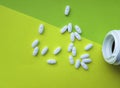 Bottle and white medical pills a aspirin green background Royalty Free Stock Photo