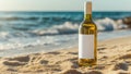 Bottle of white wine with blank label wine on a sandy beach with the sunset ocean in the background. Royalty Free Stock Photo