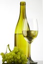 Bottle with white wine and glass and grapes Royalty Free Stock Photo