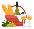 Bottle of white wine, wine in glasses, baguettes, grape and a picnic basket.