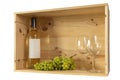 A bottle of white wine, two wine glasses and white grapes in a wooden box from wine bottles Royalty Free Stock Photo