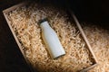 Bottle of white yoghurt in wooden box