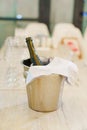 A bottle of wine or champagne in a ice bucket. cooling drinks. Royalty Free Stock Photo