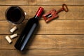 Bottle of wine glass corkscrew and corkscrew on wooden background. Top view with copy space Royalty Free Stock Photo