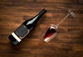 Bottle of wine and glass on old wood background Royalty Free Stock Photo