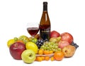 Bottle of wine and glass surrounded by fruit Royalty Free Stock Photo