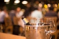 Bottle of wine in ice bucket with wine glasses Royalty Free Stock Photo