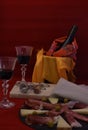 Bottle of wine refrigerator and glasses on red background Royalty Free Stock Photo