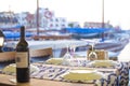 Bottle of wine with pictureque view of Kyrenia harbour in Cyprus