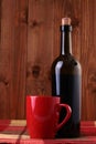 Bottle of wine and red cup Royalty Free Stock Photo