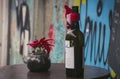 A bottle of wine on a table near a cozy city cafe