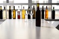 Bottle of wine and two empty glasses on table in bar Royalty Free Stock Photo