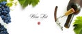 Bottle of wine with wineglass, corkscrew and bunch of grapes on a white background. Panoramic top view with space for text Royalty Free Stock Photo