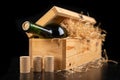 A bottle of wine in a wooden box. A tasty alcoholic drink in an elegant package Royalty Free Stock Photo