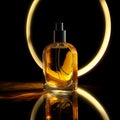 A bottle of yellow perfume is placed on the circular mirror. Royalty Free Stock Photo