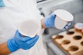 Bottle of yoghurt on automated conveyor line, process of milk filling and packaging, Dairy production