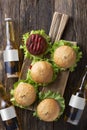 Bottled beer and Fresh tasty burgers with juicy meat patties, fast food, Royalty Free Stock Photo