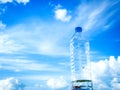 Bottled drinking water against blue sky and cloud 002