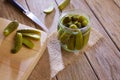 Bottled pickles cucumbers in wooden table