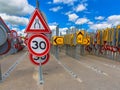 Bottleneck road narrowing speed limit sign