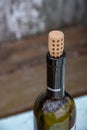 Bottleneck of white wine bottle with dotted cork Royalty Free Stock Photo