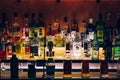 Bottles of alcohol and spirits at a restaurant bar.