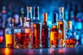 Bottles with alcoholic beverages on the background of the night club. Royalty Free Stock Photo
