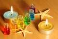 Bottles with aroma oils, candles and starfish Royalty Free Stock Photo