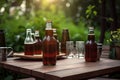 bottles of beer and glasses on wooden table in summer garden Royalty Free Stock Photo