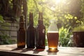 bottles of beer and glasses on wooden table in summer garden Royalty Free Stock Photo