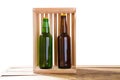 Bottles of beer on wooden table isolated on white background, glass bottles mock up, different beer bottles, empty mockup Royalty Free Stock Photo