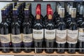 Bottles of Cabernet Sauvignon wine stand on a shelf in duty free shop airport in Muscat, Oman Royalty Free Stock Photo