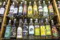 bottles of cachaca on a shelf, inside a shop in the historic city of Paraty