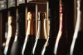 Bottles of champagne on the shelf, close-up image of alcoholic beverages in the wine cellar. Close-up image. Royalty Free Stock Photo