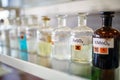 Bottles with chemicals on the shelf in the laboratory. Chemistry, lab, chemicals