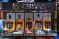 Bottles of Chivas Regal scotch whisky on a shelf in duty free shop airport in Muscat, Oman Royalty Free Stock Photo