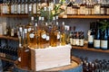 Bottles with cognac, shelves with alcoholic drinks in the shop