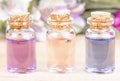 Bottles of colorful floral essential oil. Alternative medical concept