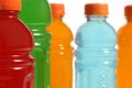 Bottles of Colorful Sports Drinks on White Background