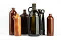 A composition of various dark bottles on a white background Royalty Free Stock Photo