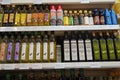 Bottles of cooking oils for sale. Corn, sunflower, extra virgin olive oils. Rows of high quality healthy cooking oil. Variety