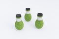 3 Bottles covered with grass Royalty Free Stock Photo