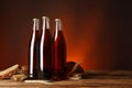 Bottles of delicious fresh kvass, spikelets and bread on wooden table. Space for text