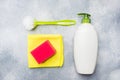 Bottles with detergents, brushes and sponges on concrete background. Colorful cleaning products. Home cleaning concept. Top view, Royalty Free Stock Photo